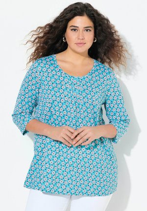 Blusa turchese a maniche lunghe con un motivo floreale, dotata di scollatura rotonda e maniche a tre quarti. Tessuto leggero con una vestibilità comoda.