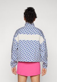 J.LINDEBERG Sports MINNA ANORAK - Windbreaker - moonbeam