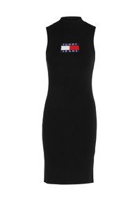 Abito senza maniche in maglia a coste nera con un alto collo. Presenta un logo ricamato "TOMMY JEANS" sul davanti. Vestibilità a tubino.
