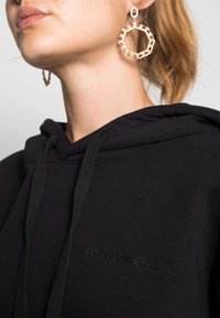 Colourful Rebel MOTH GLITTER OVERSIZED HOODIE WOMEN - Camisola - black