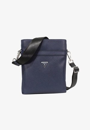 Navy blue crossbody bag with a smooth, textured finish, adjustable black strap, and silver triangular logo on the front.