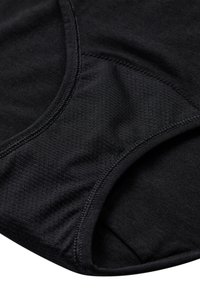 Sort stof sports BH med en subtil mesh tekstur, sømløse kanter og blød elasticitet for komfort og støtte.