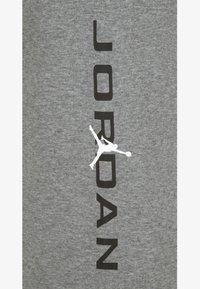Jordan UNISEX - Tepláky - grey