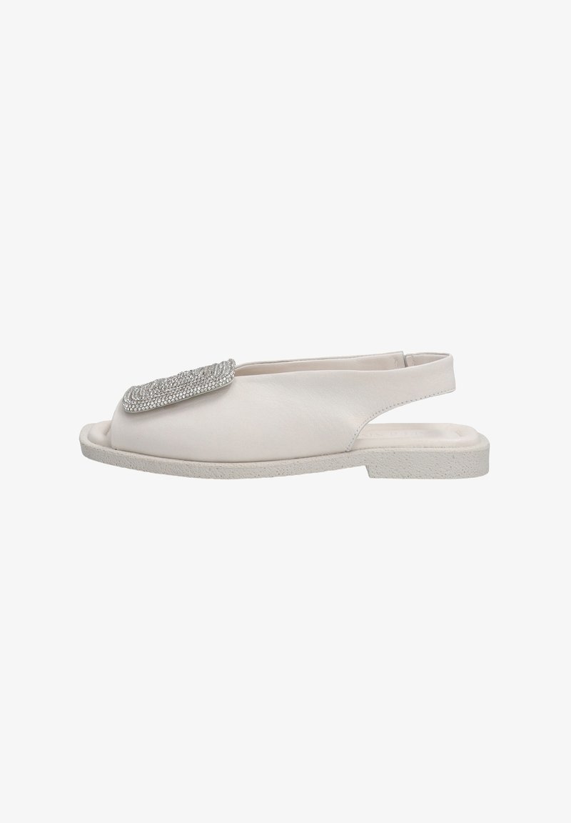 White leather sandal with a wide rhinestone-accented strap, open toe, and back heel support. Textured sole provides grip.