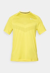 STRIDE TOP - T-shirt de sport - lightening/reflective silver-coloured