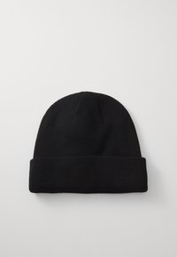 Black knit beanie made of soft fabric, featuring a rolled cuff, ribbed texture, and a smooth top, designed for warmth and comfort.