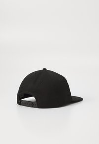 Black baseball cap with a flat brim, soft fabric, adjustable snapback closure, and a small circular button on top.