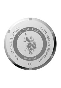 Quadrante in acciaio inossidabile con finitura lucida; presenta una grafica di un giocatore di polo, testo per il brand, indicazione di resistenza all'acqua e marcatura CE.