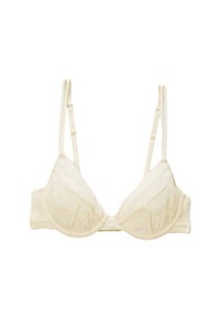 Soutien-gorge crème avec bordure en dentelle, de forme triangulaire, avec des bretelles ajustables et une texture lisse présentant des motifs complexes sur les bonnets.
