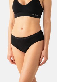 Culotte bikini en mélange de coton noir avec une ceinture élastique douce et des détails délicats cousus autour des bords. Conçue pour le confort et l'ajustement.