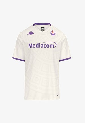 Maglia da calcio bianca con bordi viola, logo dello sponsor Mediacom, logo Kappa sul petto e stemma del club Fiorentina in alto a sinistra.