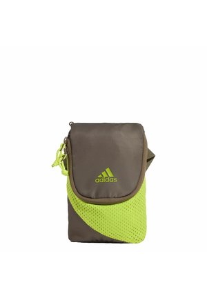Small Adidas crossbody bag in brown and neon green with a flap closure and logo on the front.