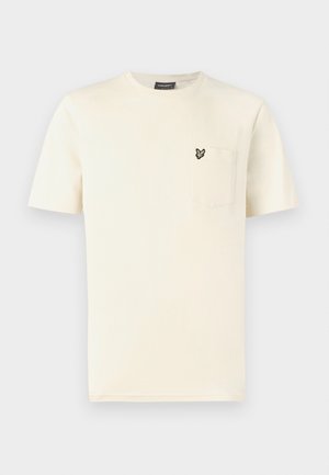 T-skjorte i kremfarget bomull med rund hals, korte ermer og en brystlomme på venstre side med et lite sommerfuglebroderi.