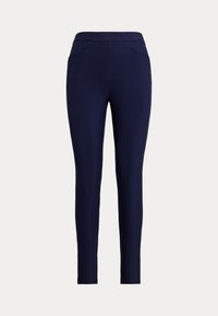 Παντελόνι navy slim-fit με πλαϊνές τσέπες και ψηλή μέση, εμφανίζεται σε απλό ανοιχτό φόντο.