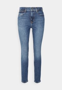 Jeans slim fit de tiro medio en denim azul oscuro con una textura desgastada, que cuentan con cinco bolsillos y un cierre de botón. Estilo clásico con costuras visibles.