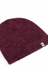 Burgundy knitted beanie hat with a soft, textured surface and a small woven label on the side. Rounded crown and wide hem.