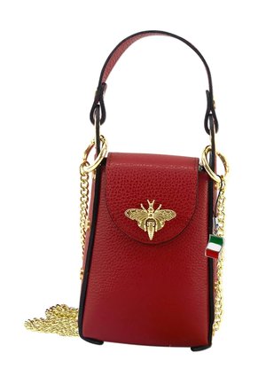 Red leather handbag with a structured design, featuring a gold bee emblem, gold chain strap, and a small Italian flag charm.