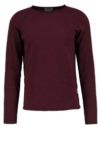 Burgundy långärmad tröja med rundad halsringning, texturerat tyg och raglanärmar. Har en liten logotagg i fållen.