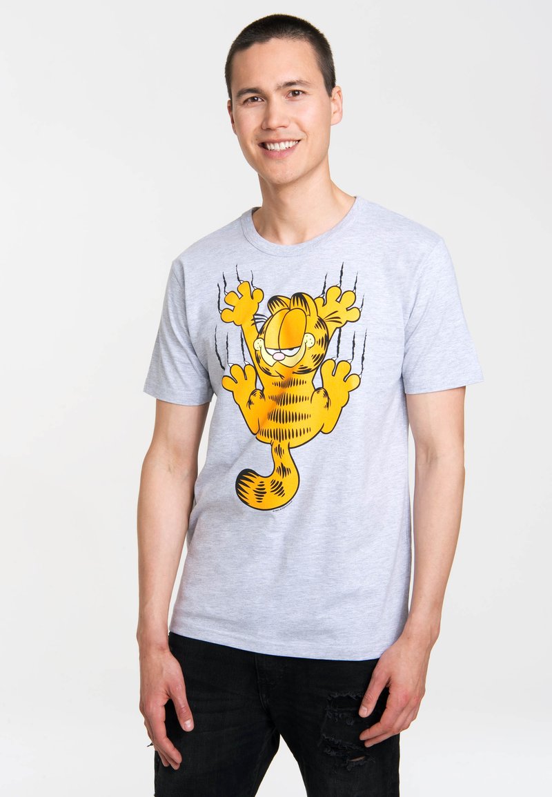 Grey cotton t-shirt with a large yellow cartoon cat graphic. Short sleeves, crew neck, relaxed fit, and visible stitching details.