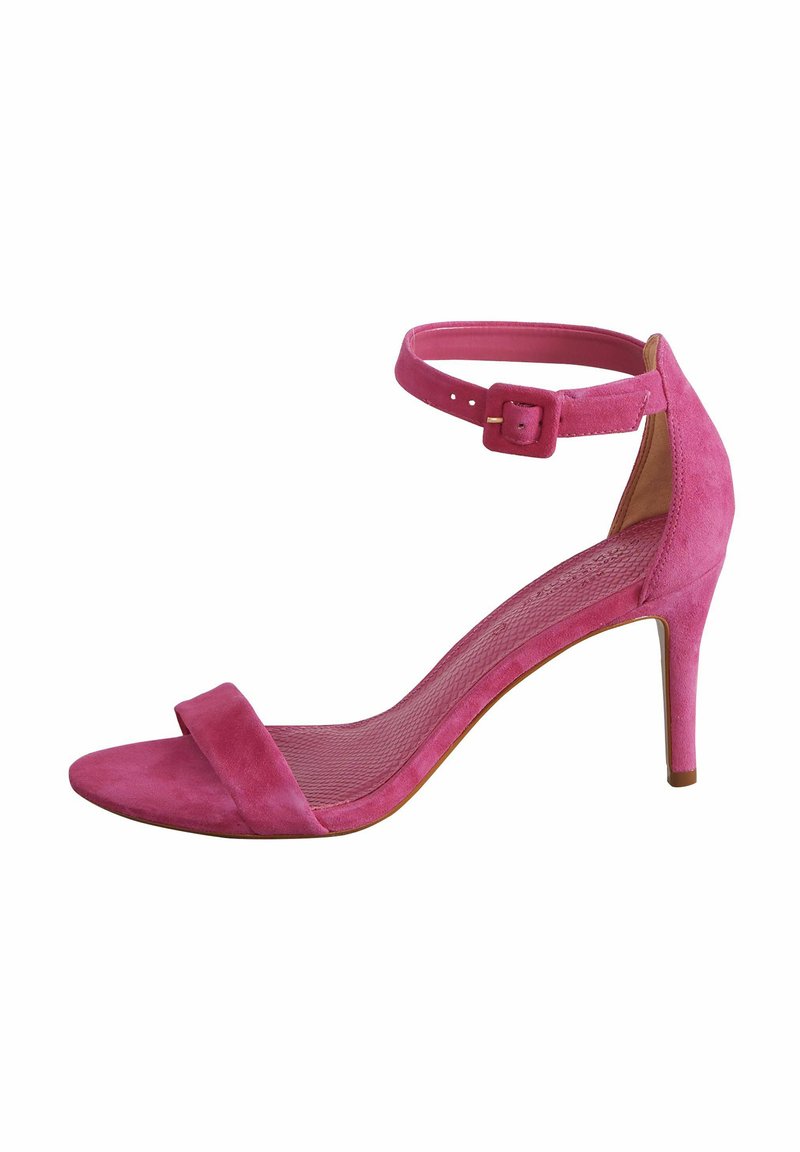 Sandal con tacco in suede rosa, dotata di una sottile cinghia alla caviglia con fibbia. Presenta una fascia liscia sopra le dita dei piedi e una soletta strutturata.