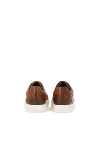 Brown leather sneakers with a smooth texture, slip-on design, and white rubber soles. Features minimal stitching and a rounded toe shape.