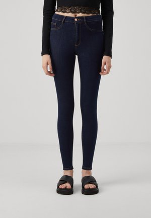 Vaqueros pitillo - rinsed denim