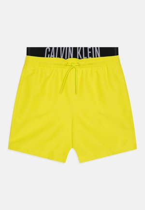 Neon geltonos maudymosi šortai su juodu elastingu juosmeniu, kuriame yra baltos spalvos "CALVIN KLEIN" užrašas, raištelis ir šoninės kišenės.