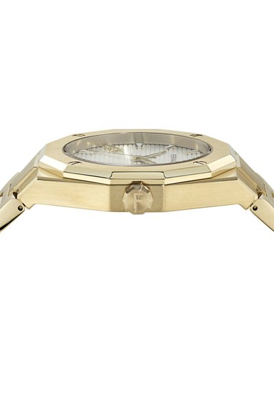 Zelta tonī rokas pulkstenis ar baltu teksturētu ciparnīcu, astoņstūra formu ietvaru un vainagu, uz kura iegravēta burts "F".