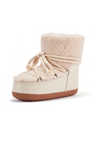Béžové topánky z umelej kožušiny s čipkovým detailom, smotanová kožená časť, zaoblený tvar, textúrovaná platforma a mäkká podšívka pre teplo.
