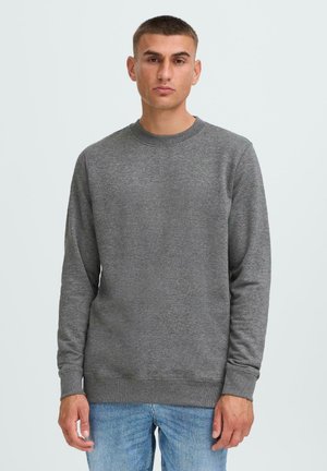 Gray crewneck sweatshirt made of soft cotton blend, featuring long sleeves and ribbed cuffs. Simple, unembellished design in a regular fit.