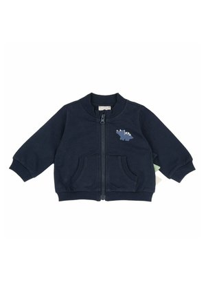Giubbotto blu navy con zip per bambini piccoli, con polsini a costine, tasche frontali e piccola grafica di dinosauro sul petto sinistro.