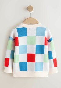 Svetre s krémovým základom zdobené mriežkovým vzorom modrých, červených, zelených a svetlomodrých štvorcov. Rebrovaný golier a manžety. Neformálny dizajn.