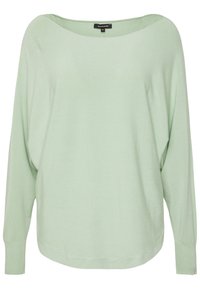 Suéter de punto de color verde claro y de gran tamaño, con un cuello ancho, mangas largas y puños acanalados, que presenta una textura suave y un diseño minimalista.