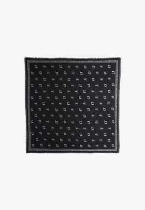 Black scarf featuring a repeated pattern of monochromatic faces, bordered with a contrasting trim labeled "Karl Lagerfeld." Soft texture, square shape.