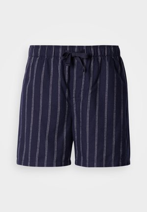 Σορτς σε σκούρο μπλε χρώμα με λευκές κάθετες ρίγες, διαθέτει ελαστική μέση με κορδόνι και πλαϊνές τσέπες. Κατασκευασμένο από απαλό, ελαφρύ ύφασμα.