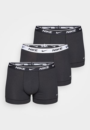 Sorte bomuldsboxershorts med en hvid og sort elastisk talje med Nike-logoet. Tre par præsenteret med en glat tekstur.