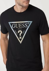 Guess Marškinėliai su spaudiniu - schwarz