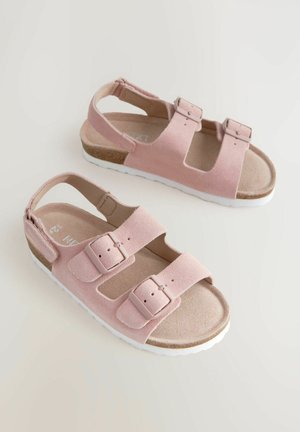 Roosa seema sandaalid kolme reguleeritava rihmaga, pehme tallaga ja valge kummist tallaga. Avatud kand disain lihtsaks selga panemiseks.