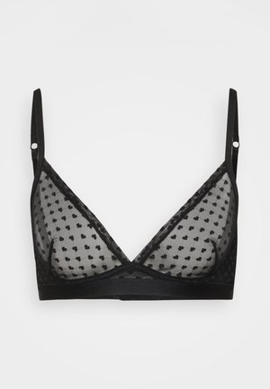Zwarte doorschijnende bralette met verstelbare bandjes en een hartvormig patroon op de mesh stof, met een zachte band onder de cups.