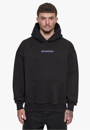 Black hoodie made of soft material with a kangaroo pocket, ribbed cuffs, and hem. Features a blue and red "DpszeStudios" logo on the chest.