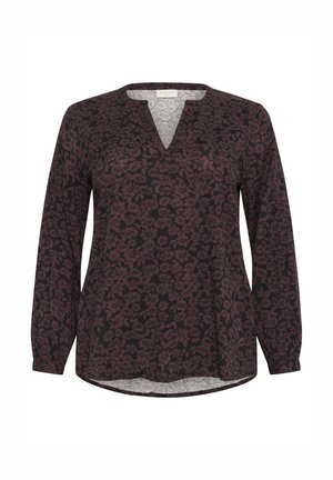Long-sleeve blouse in dark red and black floral print with a V-neckline. Made of lightweight fabric with a slightly curved hem.