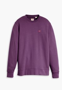 Sweat-shirt violet avec un col rond et des poignets côtelés. Présente un petit logo rouge sur la poitrine. Confectionné en tissu doux et texturé.