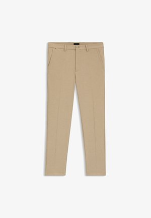 Pantaloni beige realizzati in tessuto testurizzato, caratterizzati da una vestibilità slim, vita piatta, due tasche laterali e chiusura con zip e bottone.
