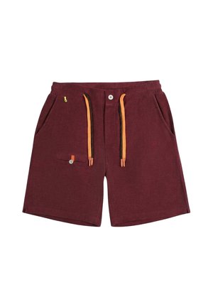 Short bordeaux avec taille élastique, cordons orange, bouton à l'avant, poches latérales et petite poche boutonnée sur la jambe gauche.