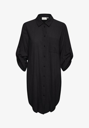 Chemise noire à boutons avec col, manches longues retroussées, une poche poitrine et coupe décontractée, fabriquée dans un tissu texturé.