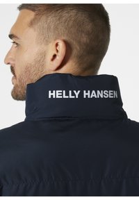 Helly Hansen YU 23 REVERSIBLE PUFFER - Chaqueta de invierno - navy