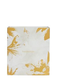 Vierkante doos met een witte achtergrond, versierd met gele bloempatronen en de tekst "heideman" in een subtiele lettertype. Gladde oppervlaktextuur.