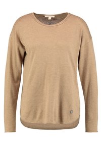 Pull beige manches longues avec un col rond, une texture douce et de discrètes fentes latérales. Comprend un petit logo accentué sur l'ourlet.
