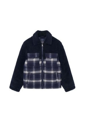 Veste polaire bleu marine avec poches avant à carreaux, fermeture éclair intégrale et col, mêlant des motifs unis et à carreaux.