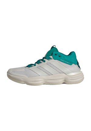 Sneaker sportiva bianca e turchese bassa con tomaia in mesh, suola imbottita e scritta "Court Stabil" vicino al collarino della caviglia, vista laterale sinistra.